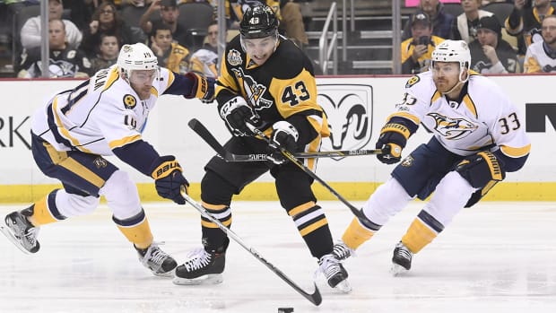 sheary-ekholm-wilson-playoffs-nhl-1300.jpg